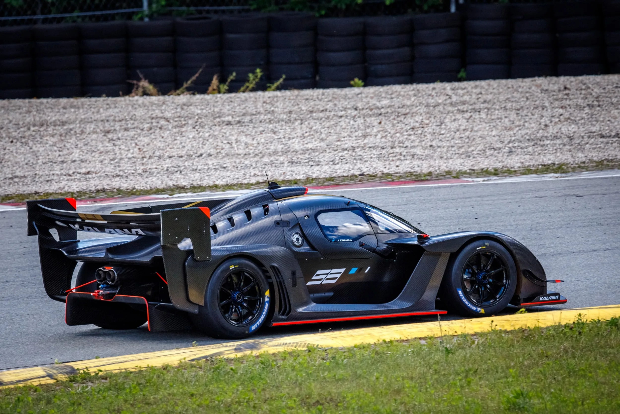 Kalana development mule in blue livery, full side profile at Porsche Ring